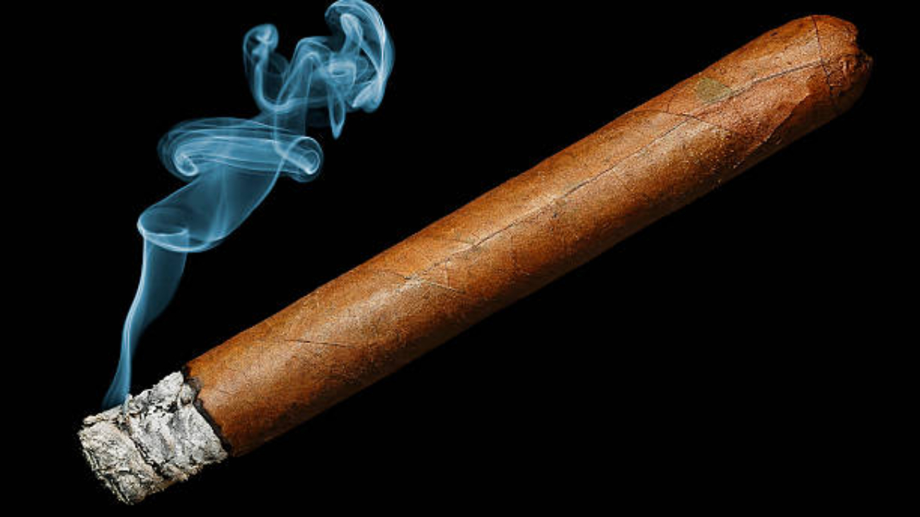 cigar with smoke isolated on black background